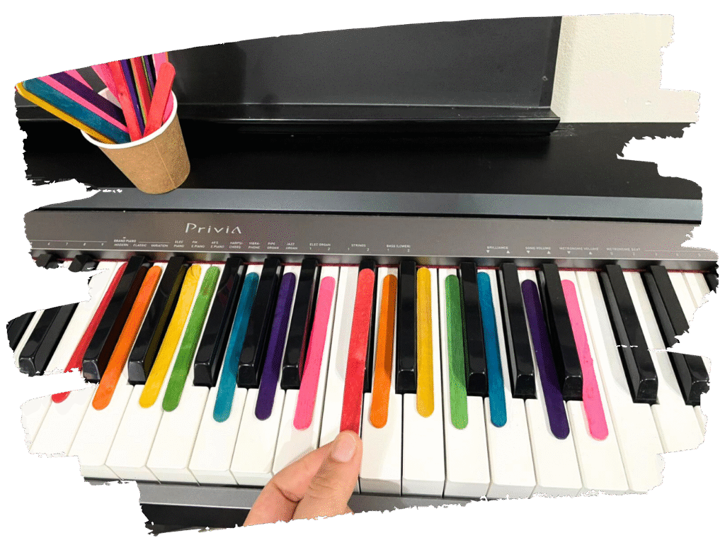 Color-coded popsicle stick piano activity – creative piano keys game to teach note positions visually.